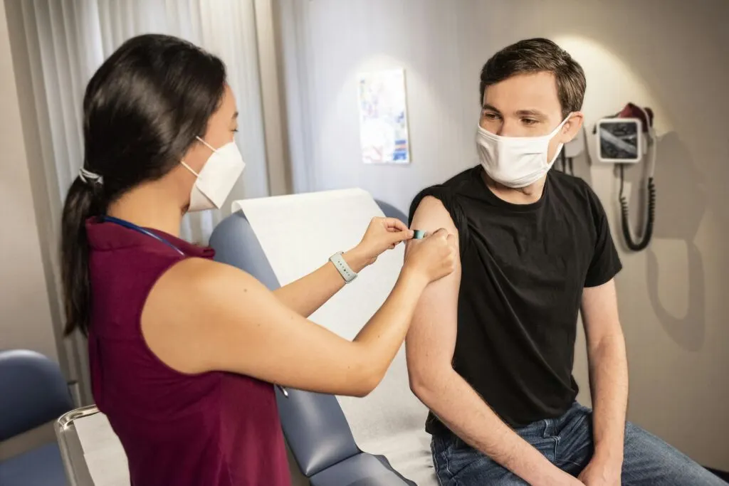 Japanese Encephalitis Vaccine| VacciBuddy| Doctor giving vaccine to people
